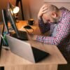 Male programmer stressed out at work
