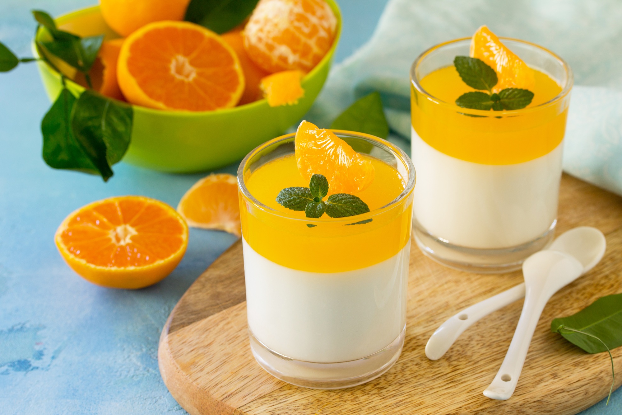 Panna cotta with tangerines jelly and mint, Italian dessert, homemade cuisine.